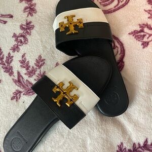 Tory Burch Black and White Slides with Gold Emblem